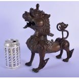 A 19TH CENTURY SOUTH EAST ASIAN BRONZE FIGURE OF A BUDDHISTIC LION modelled scowling. 21 cm x 27 cm.