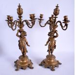 A PAIR OF 19TH CENTURY FRENCH BRONZE PUTTI CANDELABRA overlaid with acanthus. 50 cm x 22 cm.