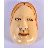 A MID 19TH CENTURY JAPANESE MEIJI PERIOD CARVED IVORY NOH MASK NETSUKE. 4.5 cm x 2.5 cm.