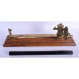 A 19TH CENTURY GOODBRAND & HOLLAND BRASS TENSILE STRENGTH GAUGE together with an ebonised maritime n