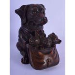 A 19TH CENTURY BAVARIAN BLACK FOREST CARVED WOOD INKWELL modelled as a dog with foxes in a pouch. 14