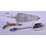AN ANTIQUE SILVER CAKE SLICE together with a silver and enamel spoon. 78 grams overall. (3)