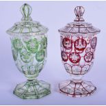 A PAIR OF ANTIQUE BOHEMIAN GLASSES AND COVERS. 17 cm high.