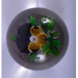 A 19TH CENTURY FRENCH GLASS PAPERWEIGHT Attributed to Clichy, with a single yellow and purple flower