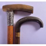 TWO ANTIQUE CONTINENTAL CARVED RHINOCEROS HORN WALKING CANES. 90 cm long. (2)