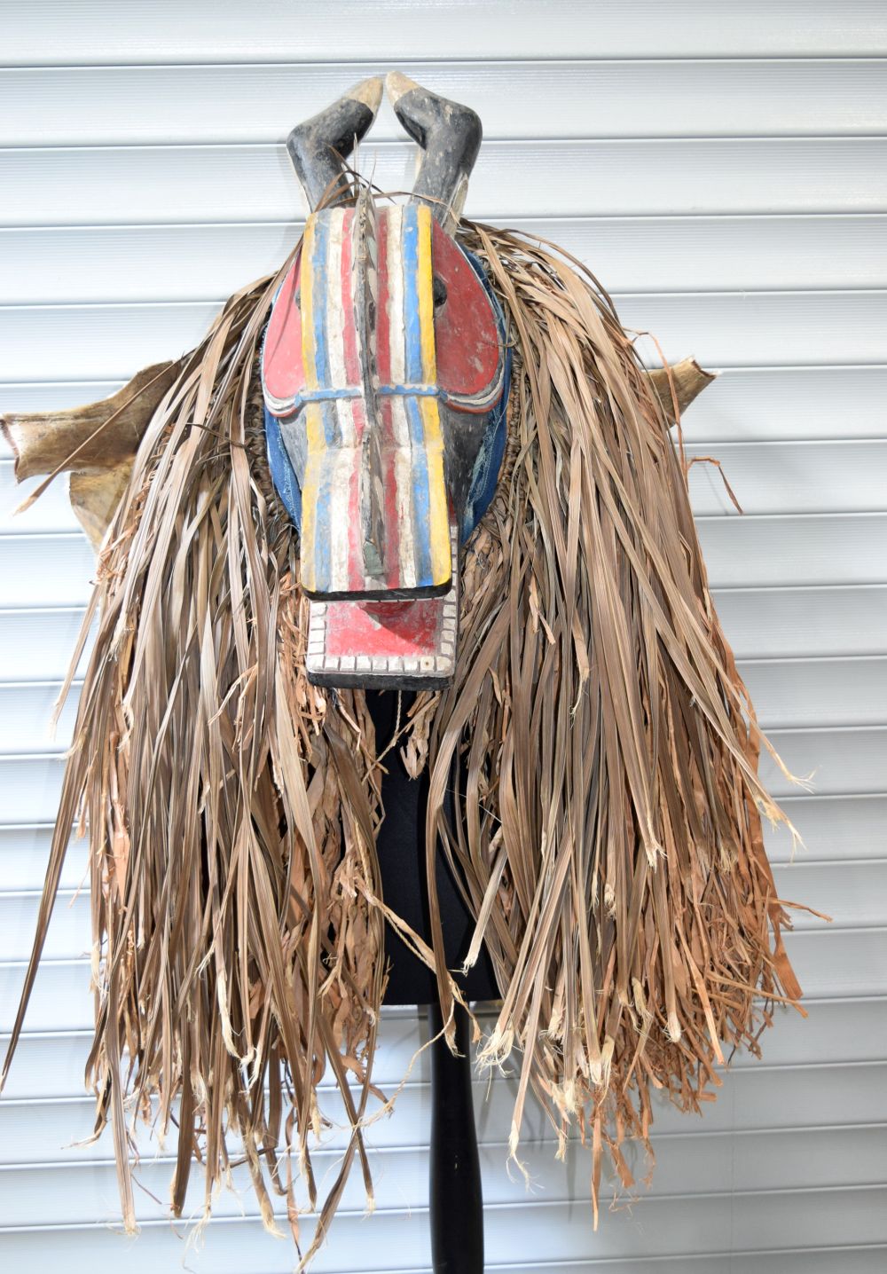 An African tribal Baule Goli Glin mask & costume. 110 x 74cm