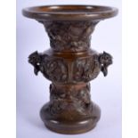 A 19TH CENTURY JAPANESE MEIJI PERIOD BRONZE TWIN HANDLED VASE decorated in relief with Buddhistic an