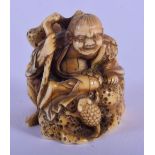 A 19TH CENTURY JAPANESE MEIJI PERIOD CARVED IVORY NETSUKE depicting Gama Sennin. 3.5 cm x 3 cm.