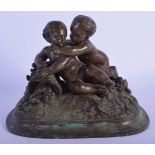 AN ANTIQUE EUROPEAN BRONZE FIGURE OF TWO PUTTI modelled beside baskets of flowers. 13 cm x 15 cm.