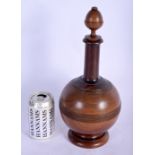A LARGE 19TH CENTURY EUROPEAN CARVED TREEN TEA CADDY VASE AND COVER of bulbous form. 34 cm high.
