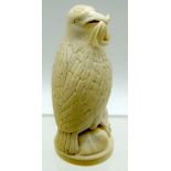 A European Ivory figure of a bird on a stand. 13cm. (2)