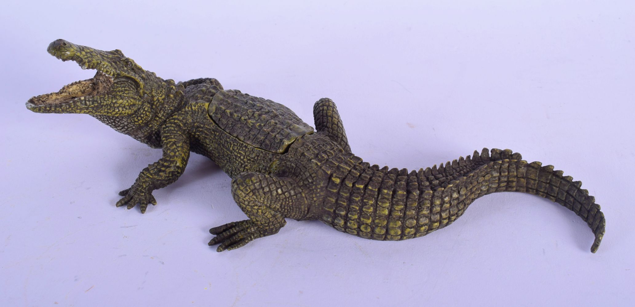 A CONTEMPORARY COLD PAINTED BRONZE FIGURE OF AN ALLIGATOR modelled with a reclining female inside. 2