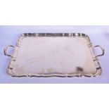 A LARGE TWIN HANDLED SILVER SERVING TRAY. Sheffield 1923. 4188 grams. 69 cm x 42 cm.