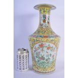 A 19TH CENTURY CHINESE CANTON FAMILLE JAUNE PORCELAIN VASE Qing, painted with landscapes and foliage