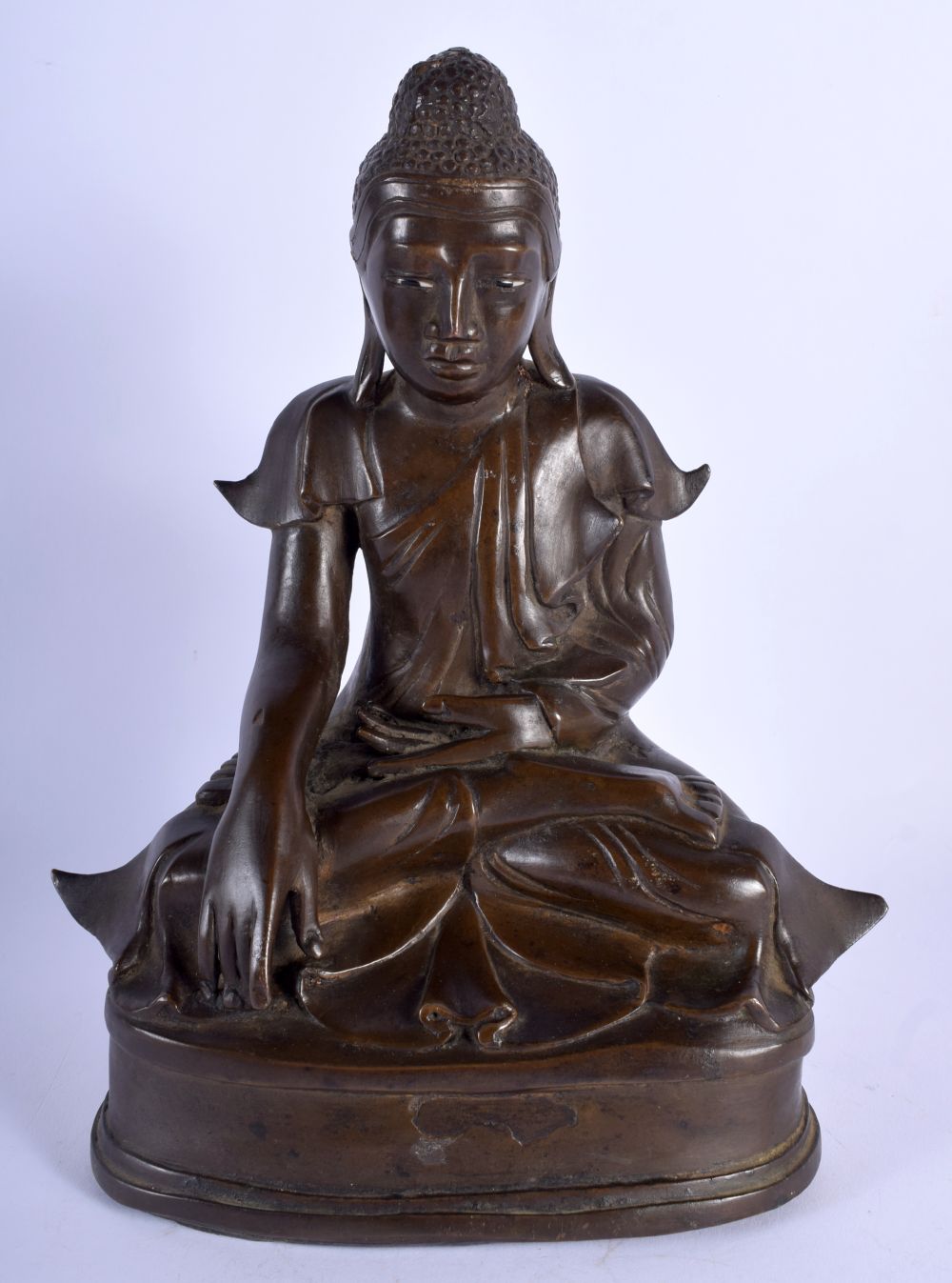 A 19TH CENTURY SOUTH EAST ASIAN BRONZE FIGURE OF A BUDDHA modelled upon a triangular base. 25 cm x 1