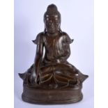 A 19TH CENTURY SOUTH EAST ASIAN BRONZE FIGURE OF A BUDDHA modelled upon a triangular base. 25 cm x 1