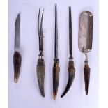 FIVE 19TH CENTURY CONTINENTAL CARVED BUFFALO HORN HANDLED TOOLS. Largest 27 cm long. (5)