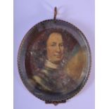 A 17TH CENTURY PAINTED CRYSTAL OIL ON COPPER PORTRAIT MINIATURE depicting a handsome male. 9 cm x 7