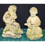 A stone composite Dwarf garden statue together with a boy . 31cm (2).