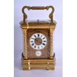 A 19TH CENTURY FRENCH ¼ REPEATING BRASS CARRIAGE CLOCK overlaid with open work foliage. 20.5 cm high