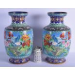 A LARGE PAIR OF 1950S CHINESE CLOISONNE ENAMEL VASES decorated with birds and foliage. 38 cm x 15 cm