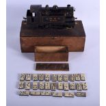 AN ANTIQUE CARVED DOMINO SET together with a bowman tinplate train. Largest 24 cm long. (2)