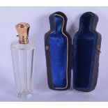 A CASED FRENCH 18CT GOLD TOPPED SCENT BOTTLE. Bottle 9.7cm x 3cm, weight 44g
