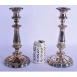 A PAIR OF ANTIQUE SILVER PLATED CANDLESTICKS. 30 cm high.