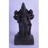 AN ANTIQUE MIDDLE EASTERN VOLCANIC STONE FIGURE OF A BUDDHISTIC DEITY modelled upon a rectangular ba