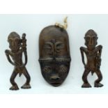 A pair of African Tribal bronze figures together with a pottery mask 20cm (3)