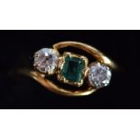 A GOLD RING INSET WITH TWO DIAMONDS. Size K, 2g