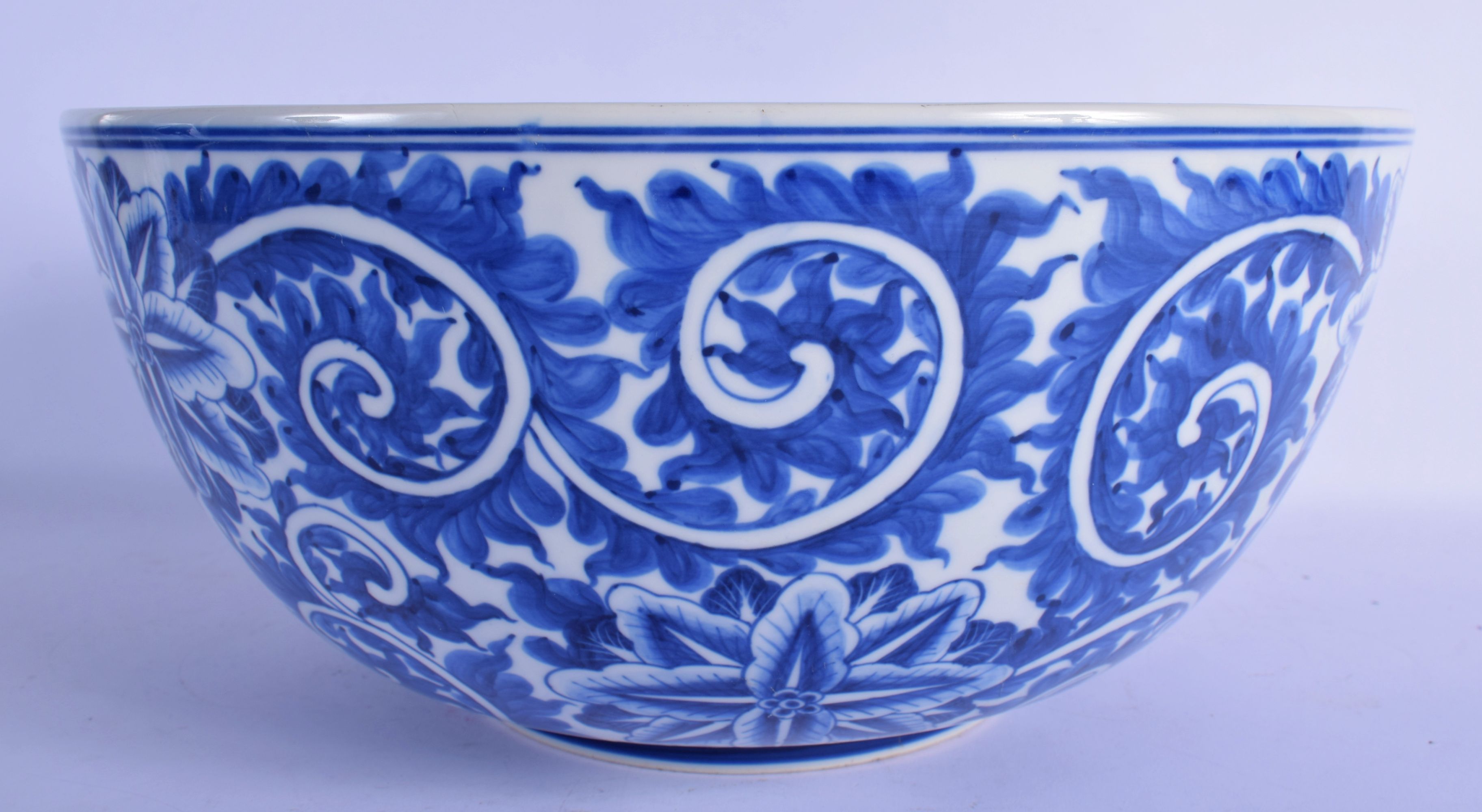 A LARGE 19TH CENTURY CONTINENTAL BLUE AND WHITE PORCELAIN BOWL well painted with bold floral sprays. - Image 3 of 5