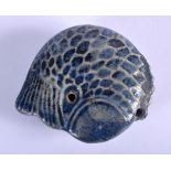 A 16TH/17TH CENTURY CHINESE BLUE GLAZED POTTERY WATER DROPPER Ming, formed as a coiled carp. 6 cm x
