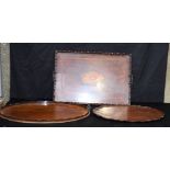 A large Victorian wooden inlaid tray, together with two other wooden trays. Largest 62 x 43cm (3)