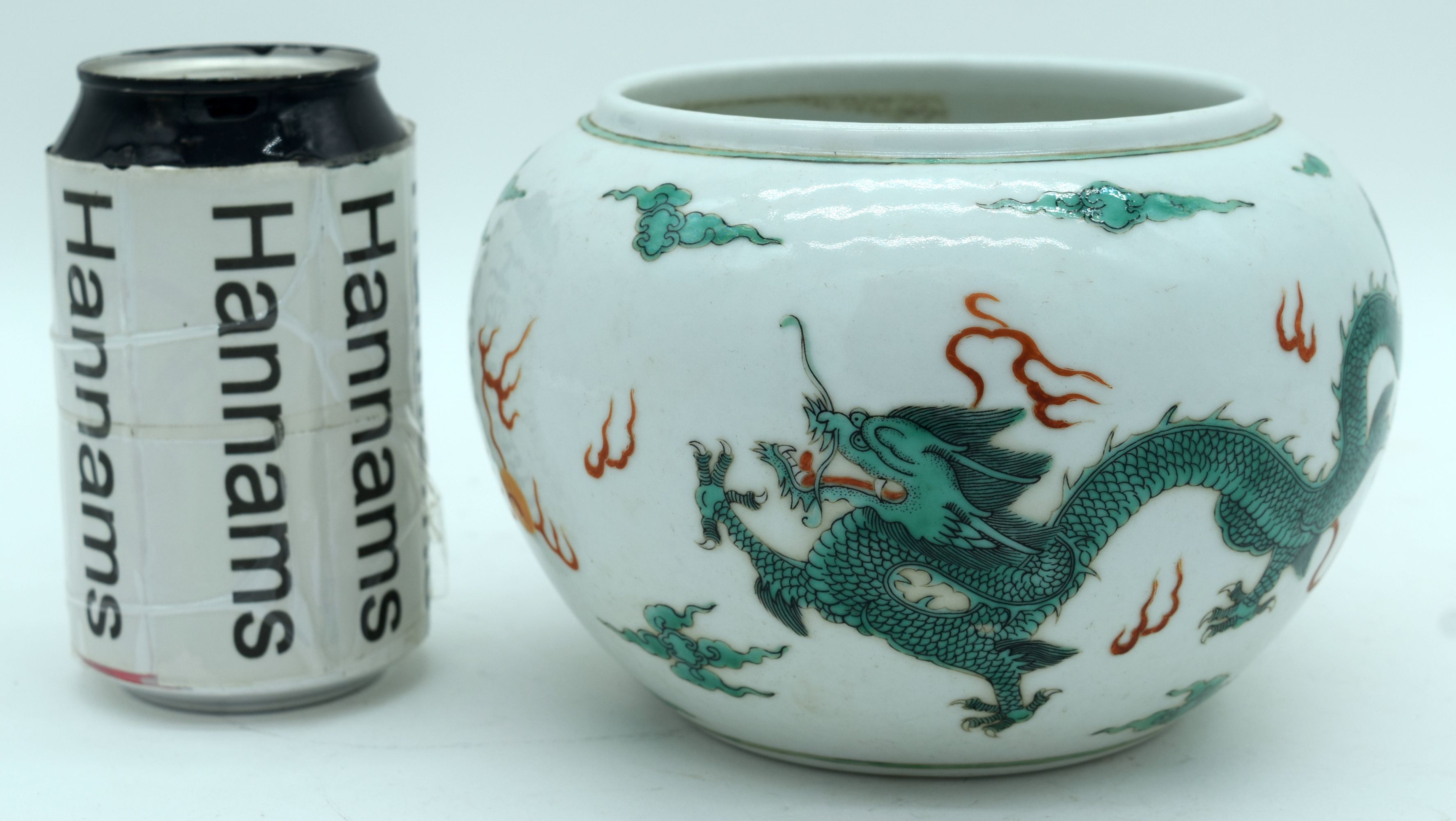 A Chinese porcelain bowl decorated with dragons and clouds. 12 x 17cm