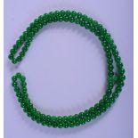 A JADE TYPE BEAD NECKLACE. 110cm long, weight 158g