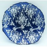 A vintage blue carnival glass dish decorated with silver foliage 5 x 28cm.