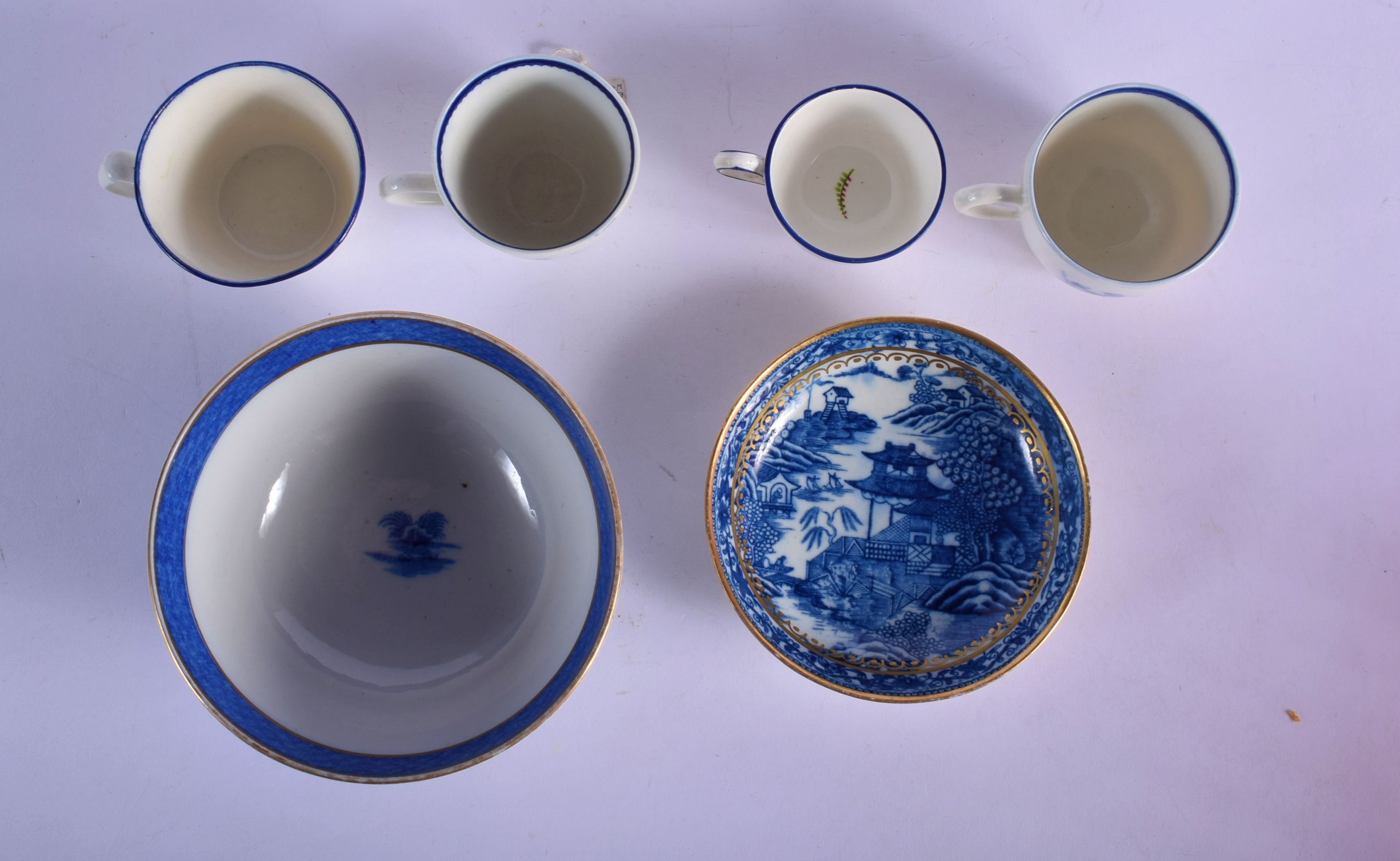 THREE LATE 18TH CENTURY CAUGHLEY BLUE AND WHITE CUPS, with a Caughley Fenced Garden Pattern Saucer - Image 11 of 12