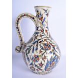 A 19TH CENTURY CONTINENTAL IZNIK FAIENCE GLAZED ENAMELLED JUG possibly Kutahya (Ottoman) painted wit