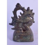 AN 18TH/19TH CENTURY BURMESE BRONZE OPIUM WEIGHT modelled as a buddhistic lion. 13 cm x 7 cm.