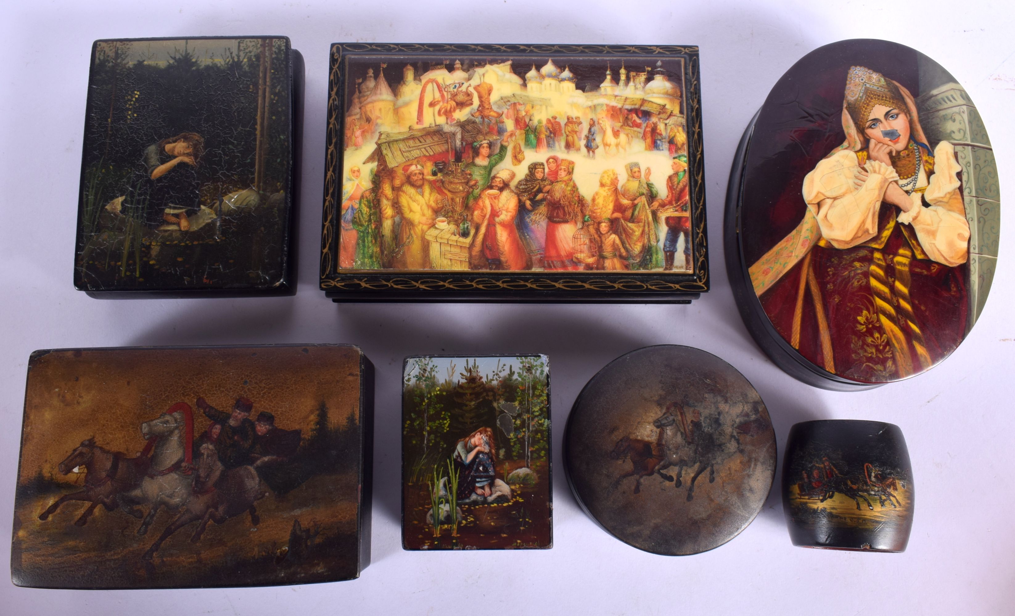 FIVE 19TH CENTURY RUSSIAN BLACK LACQUER PAPER MACHE BOXES decorated with various scenes, together wi