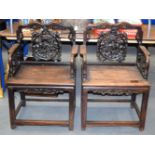 A PAIR OF 19TH CENTURY CHINESE CARVED HARDWOOD CHAIRS Qing, decorated with buddhistic lions. 100 cm