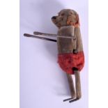 AN EARLY WIND UP TOY FIGURE OF A DOG. 10cm high