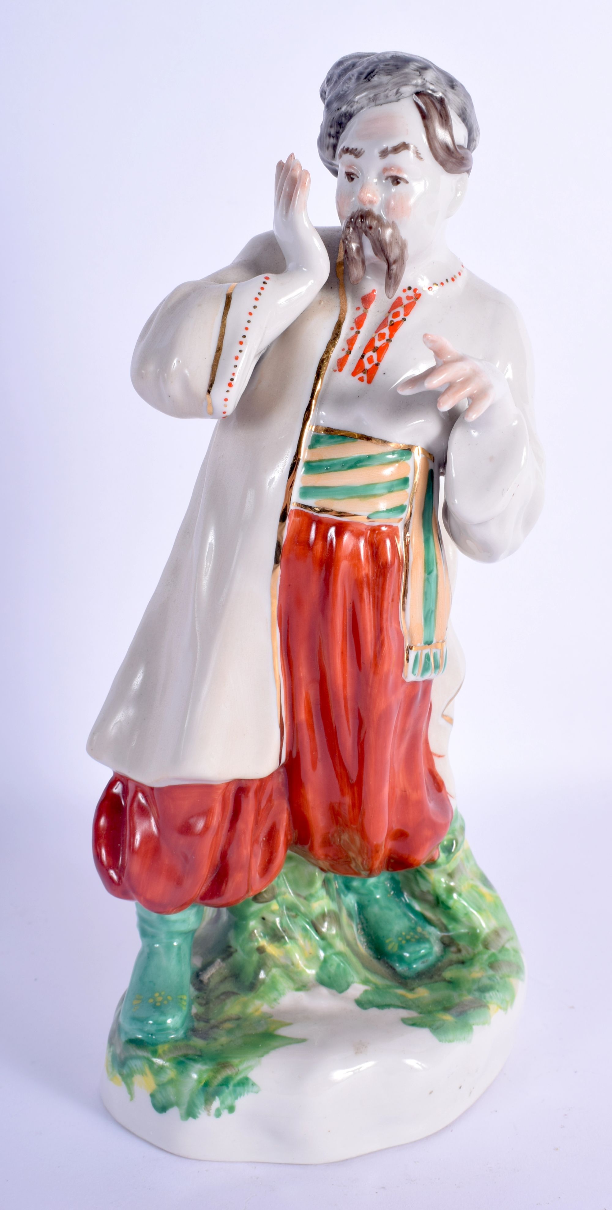 A USSR PORCELAIN FIGURE OF A MALE. 26 cm high.