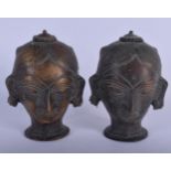 A PAIR OF ANTIQUE INDIAN BRONZE HINDU BUDDHISTIC HEADS. 14 cm high.