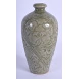 A CHINESE QING DYNASTY MINIATURE CELADON VASE decorated with flowers and trailing vines. 12 cm high.