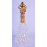 A FRENCH 18CT GOLD TOPPED SCENT BOTTLE. Bottle 11cm x 4.3cm, weight 58g