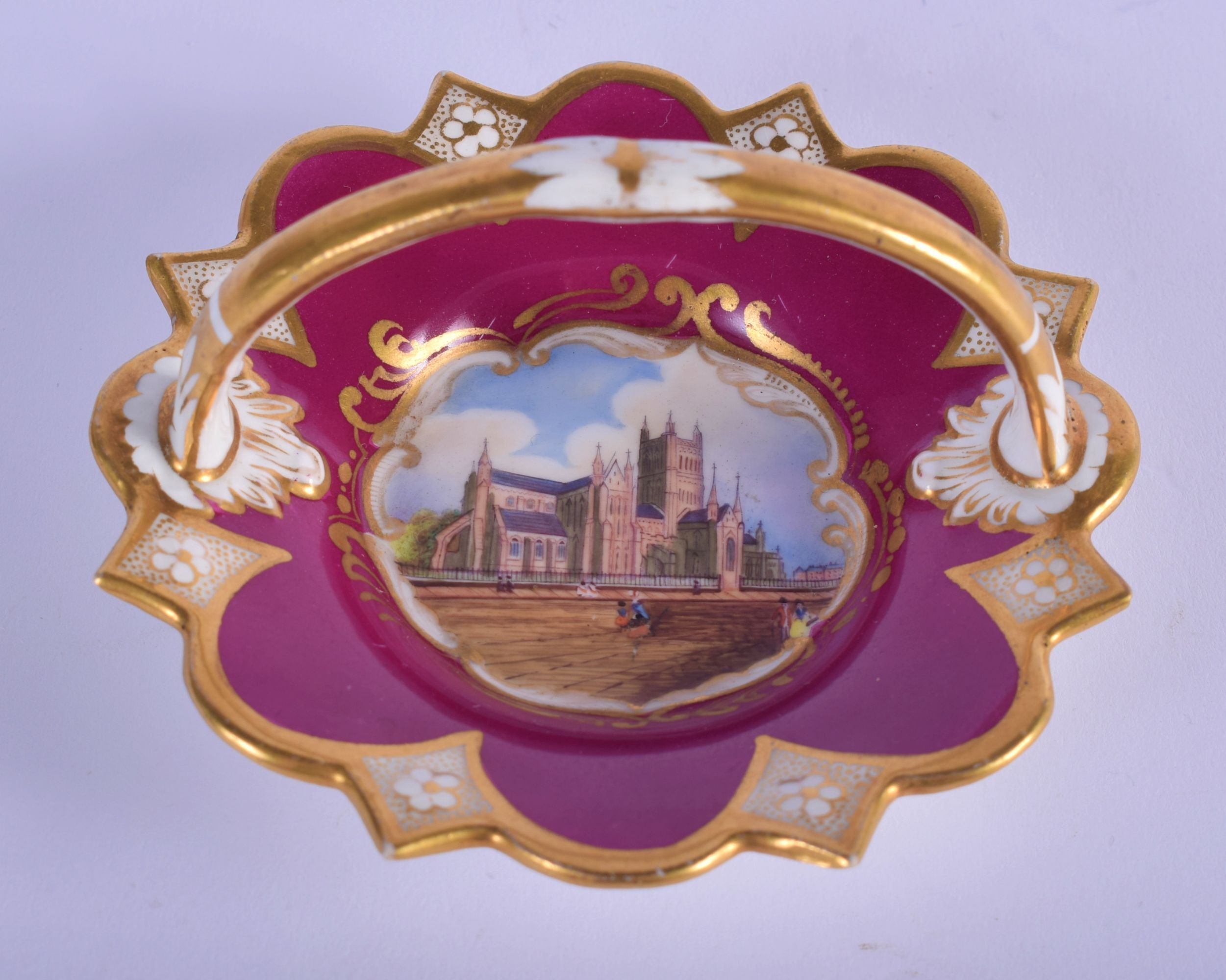 19th c. Chamberlain’s Worcester basket painted with a scene of Worcester Cathedral under a crimson b