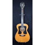 A 1960's full size Kiso Suzuki 9510 steel string acoustic guitar with MOP inlay and head stock