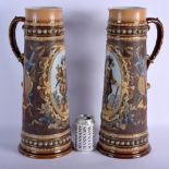 A VERY RARE LARGE PAIR OF METTLACH ENAMELLED STONEWARE BEER JUGS painted with cavaliers within lands